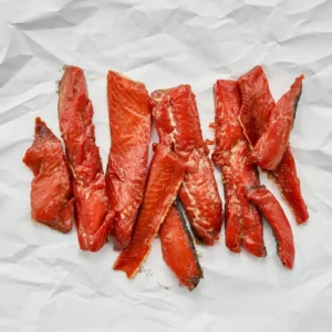 Our affordably wild-caught smoked salmon price Candy Strips are hand-cut and marinated in a brown sugar brine overnight and are then small-batched smoked.